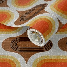 an orange and brown wallpaper with circles on it