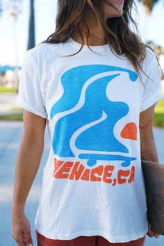 Our hometown - Venice, CA! Flowy skater design mixed and bright colors embodies Venice essence! The tee is the softest, most cozy shirt -- with a vintage wash, it looks like you grabbed it straight from your cool aunts 70s wardrobe. Our limited edition Junk Food Clothing Tee Shirt Collab is here! Now your favorite soft tees come in your favorite GRLSWIRL style. Acid Wash Retro Tops, Acid Wash Retro T-shirt With Soft-wash, Retro Acid Wash Soft-washed T-shirt, White Retro Print T-shirt For Streetwear, Graphic Tee T-shirt For Skateboarding With Relaxed Fit, Retro Blue Soft-washed T-shirt, Acid Wash Top With Graphic Design And Relaxed Fit, Acid Wash Relaxed Fit Graphic Top, Acid Wash Graphic Design Relaxed Fit Top