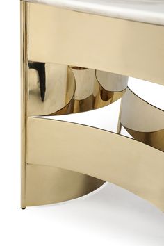 a gold and white bench with circular mirrors on it's back end, against a white background