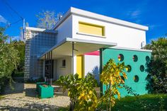 the house is painted bright green and white