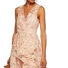 Nwt. Unworn. Absolutely Stunning. Badgley Mischka Evening Gown In Floral Lace With 3d Floral Detail. Asymmetric, Cascade Ruffle Detail Through Left. Surplice Neckline; V'd Back. Sleeveless; Tapered Straps. Peach Color. Column Silhouette. Zip At Lower Back. Polyester; Nylon Lining. Imported. Glamorous Spring Gown With Ruffles, Feminine Sleeveless Evening Dress For Wedding Guest, Spring Bridesmaid Evening Dress With Ruffles, Pink Ruffled Gown For Cocktail, Spring Wedding Evening Dress With Ruffles, Spring Cocktail Gown With Ruffles, Feminine Spring Evening Dress With Ruffles, Spring Feminine Evening Dress With Ruffles, Feminine Evening Dress For Spring Wedding