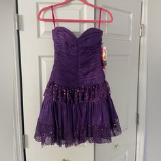 Never Worn, Purple Sequin Dress Purple Fitted Dress For Homecoming, Purple Fitted Homecoming Dress, Fitted Purple Homecoming Dress, Lined Mini Length Prom Dress, Purple Mini Dress For Prom Season, Purple Mini Length Dress For Prom Season, Formal Fitted Purple Strapless Dress, Purple Fitted Strapless Dress, Purple Ruched Dress With Fitted Bodice