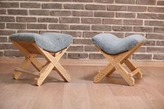 two wooden stools sitting on top of a hard wood floor