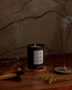 Like a crackling fire in a cozy cabin, smoky notes of woodsmoke, incense, and cedar embers meld together to form a blanket of aroma, enveloping you in its warmth. Made in Brooklyn, New York with 100% soy wax for an eco-friendly clean burn. We use lead-free cotton wicks and premium fragrance oils infused with essential oils. Our candles are vegan, cruelty-free, phthalate-free, and petroleum-free. Candle Photoshoot, Candle Board, Monochrome Aesthetic, Brooklyn Candle Studio, Candles Dark, Candles Photography, Candle Studio, Candle Glow, Thai Basil