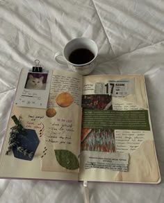 an open book with pictures and writing on it next to a cup of coffee or tea