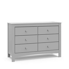 a white dresser with four drawers and two doors