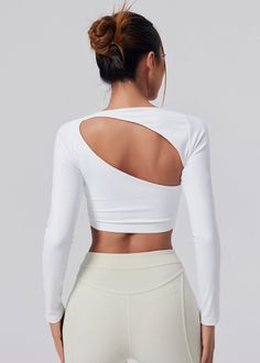 Fitted White Asymmetrical Tops, Fitted Asymmetrical White Tops, Modern Fitted Tops For Workout, White Fitted Top With Asymmetrical Neckline, Modern Fitted Workout Tops, White Asymmetrical Stretch Tops, Modern Stretch Tops For Sports, Modern Stretch Sports Top, Versatile Stretch Tops With Asymmetrical Neckline