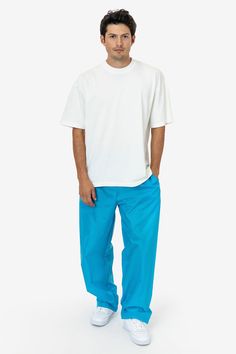 These lightweight nylon pants feature an extra wide, baggy straight leg fit. They feature 2 side pockets, 1 back pocket with velcro closure, and an elastic waistband with drawcord for an adjustable fit. These pants are unlined, making them super compact for traveling and versatile for different climates and weather needs. This fabric is great for maintaining body heat making these pants ideal for warm-ups and more. Please note: Lighter colors will have some transparency! We recommend pairing wit Relaxed Fit Wide Leg Nylon Parachute Pants, Blue Nylon Bottoms With Side Pockets, Relaxed Fit Nylon Straight Pants, Blue Parachute Pants With Side Pockets For Streetwear, Blue Parachute Pants With Side Pockets And Relaxed Fit, Blue Relaxed Fit Parachute Pants With Side Pockets, Blue Straight Hem Bottoms For Streetwear, Blue Nylon Cargo Bottoms, Blue Nylon Bottoms With Cargo Pockets