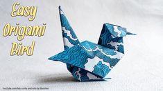 an origami bird is shown with the words easy origami bird on it