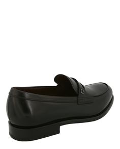 Heel height: 1" | Slides on | Almond toe | Smooth finish | Spot clean | Upper: 100% Calfskin leather; Lower: 100% Calfskin leather | Made in Italy Leather Loafers With Smooth Grain And Plain Toe, Classic Leather Loafers For Office, Timeless Leather Closed Toe Loafers, Timeless Leather Moccasins For Formal Occasions, Timeless Formal Leather Moccasins, Business Loafers With Smooth Grain And Round Toe, Business Moccasins With Leather Lining And Closed Toe, Leather Lined Closed Toe Moccasins For Business, Timeless Leather Moccasins For Business