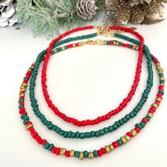 Beautiful and delicate Christmas colors Beaded Necklaces.  These dainty seed bead chokers are perfect as an everyday necklace. Enhances your Christmas outfit by wearing these cool seed bead necklaces. ♥ ITEM DETAILS: Total Length: Approx. 14 inches / 15 inches / 16 inches. The length of the necklace refers to the total length from end-to-end. Materials:  Seed beads. Color necklace available: #1 Red - #2 Green - #3 R-G-Gold ♥ GIFT IT Jewelry comes in a cute bag ready to gift! If you wish your ite Necklaces Red, Seed Bead Choker, Christmas Necklace, Bead Choker, Bead Necklaces, Color Necklace, Necklace Green, Everyday Necklace, Gold Gift