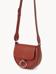 On the lookout for a bag that combines style, sophistication, and practicality? Look no further. This luxurious shoulder bag, crafted from 100% domestic calf leather, is the perfect accessory to elevate any outfit, simultaneously infusing it with a chic, autumnal vibe. One-size-fits-all for maximum versatility. Handcrafted from 100% domestic calf leather, ensuring a high-quality, durable finish. Autumn Leaf color adds a touch of warmth and is versatile enough to match any outfit. Modern Leather Flap Bag With Round Handle, Cognac Leather Bag With Round Handle, Chic Leather Flap Bag With Round Handle, Modern Saddle Bag With Top Handle In Soft Leather, Modern Top Handle Saddle Bag In Soft Leather, Leather Saddle Bag With Detachable Handle, Modern Soft Leather Saddle Bag With Top Handle, Modern Soft Leather Top Handle Saddle Bag, Everyday Calf Leather Crossbody Flap Bag