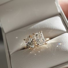 an engagement ring with two princess cut diamonds