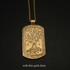 "This tree of life necklace is hand carved and shaped into a military dog tag which makes it perfect for a husband gift and unique for a nature lover. The tree of knowledge, connecting to heaven and the underworld, and the tree of life, connecting all forms of creation, are both forms of the world tree or cosmic tree, and are portrayed in various religions and philosophies as the same tree. - Hand sculpted pendant - Solid yellow bronze also called jeweler gold bronze. - Embedded 2 mm natural per Spiritual Engraved Dog Tag Jewelry, Symbolic Engraved Dog Tag Necklace, Symbolic Engraved Dog Tag Jewelry, Innovative Jewellery, The Tree Of Knowledge, Military Dog Tag, Tree Of Knowledge, Military Dog, Dog Tags Military