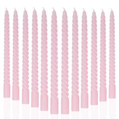 pink candles lined up in rows on a white background