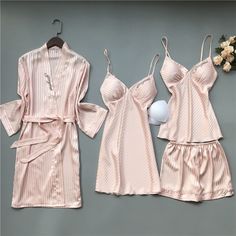 Sleep like royalty in our 4 Piece Nightwear Solid Color Stripes Set. This collection features a comfortable nightshirt, coordinating shorts, and a soft robe. Unwind in style and comfort, and experience the perfect blend of fashion and relaxation. Pamper yourself with the utmost comfort and sophistication. Specifications: Each of the sleepwear is sourced from the finest quality fabric, sewn together by quality workmanship. Made with cotton, lycra, and dacron material Unshrinkable, wrinkle-resista Elegant Summer Sleepwear For Loungewear, Elegant Summer Loungewear Sleepwear, Summer V-neck Night Robe, Spring Red Sleepwear For Lounging, Feminine V-neck Sleepwear For Lounging, Red Lounging Sets For Summer, Elegant Summer Lounging Sets, Feminine Summer Sleepwear For Home, Red Summer Sleepwear