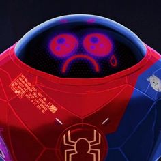 a red and blue robot with two eyes