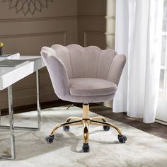 a white desk chair sitting on top of a carpeted floor next to a window