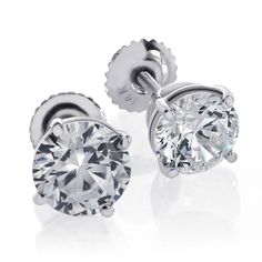 This lovely pair of round diamond stud earrings are carefully matched for size and sparkle. The total weight is 1.41 ct. (approx. 0.70 ct. each) and display beautiful colorless to near colorless F to G color and immaculately eye clean VS-2 enhanced clarity. They are skillfully set into the prongs of this 14 kt. white gold stud mounting with secure fitting screwback posts. For more information, contact Avital & Co Jewelry at (212) 764-6851 Payment: Payment must be received within 2 business d White Round Diamond Cut Earrings, Round Lab Grown Diamond Earrings With Diamond Cut, Diamond Cut Diamond Earrings, Fine Jewelry Diamond Cut Round Stone Earrings, Diamond Earrings With Prong Setting, Gia Certified Round Lab Grown Diamond Earrings, Round Vvs Clarity Diamond Earrings In Fine Jewelry Style, Anniversary Diamond Earrings With Round Stones, Round Lab Grown Diamond Fine Jewelry Earrings