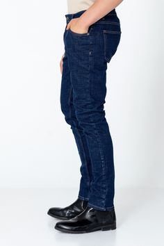 Fitted tapered jeans are a versatile and stylish choice for any wardrobe, offering a flattering silhouette and a modern look. These jeans are crafted from high-quality denim with a hint of stretch, ensuring both comfort and durability. The fitted style hugs the body in all the right places, accentuating curves while providing a sleek and streamlined appearance. The tapered leg adds a contemporary touch, narrowing towards the ankle for a flattering fit that pairs well with both sneakers and boots Denim Blue Jeans With Standard Cut Leg For Work, Modern Straight Denim Pants, Modern Dark Wash Straight Fit Bottoms, Modern Relaxed Fit Dark Wash Jeans, Standard Cut Workwear Jeans With Five Pockets, Modern Dark Wash Relaxed Fit Jeans, Modern High-rise Slim Fit Bottoms, Modern High Rise Slim Fit Bottoms, Denim Blue Slim Fit Bottoms