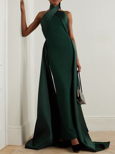 EXCLUSIVE AT NET-A-PORTER. The dramatic silhouette of Solace London's 'Rumi' gown will ensure you'll make a memorable entrance. It's cut from stretch-crepe to hug your figure with glossy satin-twill that wraps around the neck and waist before falling at the sides to an asymmetric hem. Style yours with glittering earrings and elbow-length velvet gloves. Creative Black Tie, Solace London, London Outfit, Halter Gown, Green Gown, Elegant Party Dresses, Black Tie Dress, Guest Attire, Ladies Of London