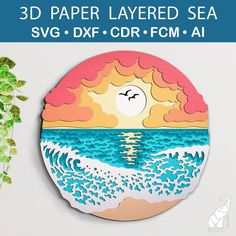 a paper layered sea scene with the sun rising over the ocean