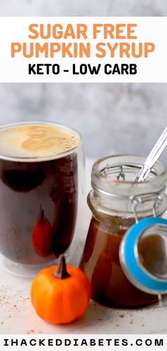 two jars of sugar free pumpkin syrup next to an orange and a jar of keto - low carb