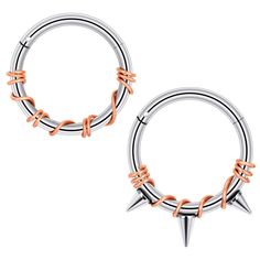 two pairs of silver and orange metal hoop earrings with spikes on each end, one in the