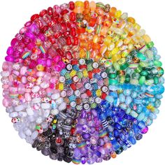 many different colored glass beads arranged in a circle on top of each other, with one bead at the center