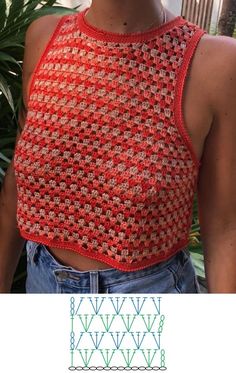 a woman with short hair wearing a red crocheted crop top and blue jeans