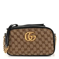 This is an authentic GUCCI Monogram Matelasse Diagonal Small GG Marmont Chain Shoulder Bag in Beige and Black. This chic shoulder bag is crafted of traditional Gucci GG monogram canvas with a beautifully stitched diagonal pattern. It features black leather trim, a polished gold chain link and black leather shoulder strap, and a polished gold Gucci GG logo on the front. The top zipper and tassel opens to a beige microfiberinterior with a patch pocket. Gucci Rectangular Gold Bag, Gucci Gold Rectangular Bag, Gold Rectangular Gucci Bag, Rectangular Gold Gucci Bag, Gold Monogram Canvas Shoulder Bag With Chain Strap, Gucci Rectangular Bag With Gold-tone Logo Plaque, Gucci Gold Bag With Gold-tone Logo Plaque, Gucci Rectangular Shoulder Bag With Gold-tone Logo, Gucci Gold Monogram Canvas Bag