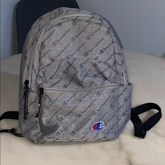 Brand New, Never Used!!! Champion Logo Gray Backpack W/ Black Zippers Interior Features Tons Of Zippered And Slit Pockets Measurements: 13” L 14” H 5” W Gray Backpack, Grey Backpacks, Champion Logo, Black Gray, Black And Grey, Bag Lady, Backpacks, Brand New, Zipper