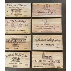 six wooden wine boxes with different labels on them