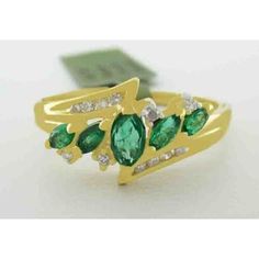 Number Of Diamonds: 12 Shape: Cushion & Round Main Stone Creation: Natural Cut Grade: Very Good Main Stone Color: Green Metal: Yellow Gold Total Carat Weight: 1.10 Carats Secondary Stone: Diamond Main Stone: Emerald Ring Size: 7.75 (Free Resizing Service - If Needed) Setting Style: Prong & Channel Metal Purity: 14k Main Stone Shape: Marquise Base Metal: Gold Number Of Gemstones: 5 Green Cluster Jewelry With Diamond Accents, Yellow Gold Marquise Emerald Ring, 14k Gold Emerald Ring For Formal Occasions, Multi-stone Diamond Emerald Ring, Multi-stone Emerald Ring With Diamonds, Green Hallmarked Cluster Jewelry, 14k Gold Emerald Ring With Diamond Cut, Designing Process, Beautiful Gold Rings