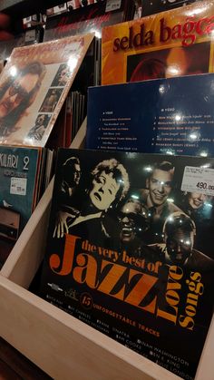 the very best of jazz cd's on display in a record store, with their covers pulled back