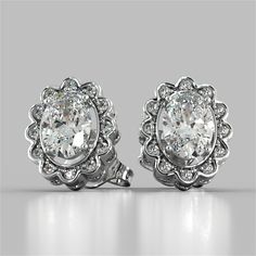 Spruce up your ensemble with this captivating set. This stunning Oval Cut Style earrings are set amidst a halo of Simulated Diamonds that are blooming like a flower with matching cutout detail on the sides. Elegant and feminine, this set is sure to impress. Oval Cut Halo Earrings Center Stone: 1CT Each Total Carat Weight: 2.12CTW Stone Clarity: VVS-1 Precious Metal: 925 Sterling Silver Model: ER2500-WH-SL Round Halo, Halo Earrings, Gold Models, Halo Earrings Studs, Rings For Girls, Fine Earrings, Metal Earrings, Floral Earrings, Oval Diamond