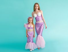 Make Dreams Come True with our Lavender Mermaid Mommy and Me Outfits! Transform your little one's fantasies into reality with our enchanting Mother-Daughter Matching Mermaid Costume Set. This stunning set includes a lavishly designed mermaid dress and tail skirt, perfect for creating unforgettable moments at birthdays, Halloween, themed parties, and special occasions. Key Features: 🌊 Under-the-Sea Elegance: Crafted in a mesmerizing shade of lavender, our costumes capture the allure of the ocean Mermaid Costume Mommy And Me, Mermaid Fin, Mermaid Theme Party, Make Dreams Come True, Sea Shell Decor, Mermaid Costume, Womens Costumes, Fish Tail, Mommy And Me Outfits