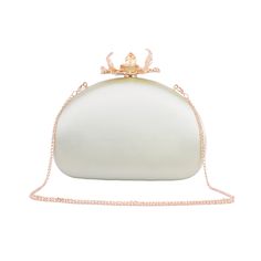 Embrace the epitome of elegance with our Silk Round Clutch, adorned with intricate flower hardware and a chic chain crossbody strap. This sophisticated accessory captures the essence of refined femininity, as the smooth silk exudes luxury and the detailed floral hardware adds a touch of romance. The versatile chain strap ensures effortless carrying, making it an ideal companion for any occasion. Elevate your style and make a statement with this beautifully crafted clutch, where the delicate allure of silk meets the timeless charm of floral design. Elegant Formal Bags With Chain Detail, Elegant Spring Evening Bag With Detachable Strap, Elegant Clutch For Wedding, Elegant Satin Evening Bag For Formal Occasions, Elegant Evening Bag With Chain, Elegant Silver Evening Bag With Chain, Luxury Bags For Wedding Guests, Elegant Evening Bag For Spring Events, Elegant Clutch With Gold-tone Hardware