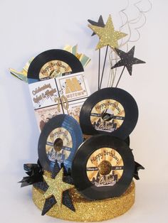 a birthday cake made to look like records and stars