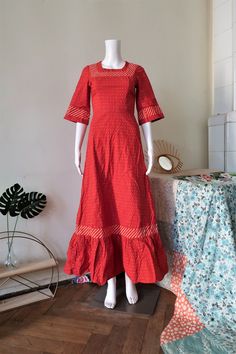 Beautiful True Vintage maxi dress from the 1970s. Fitted top, wide skirt. Made from a relatively heavy cotton fabric with dot print and striped trims. Square neck, wide sleeves, ruffle hem. Zipper in the back, unlined. Looks great with a pair of clogs and a wicker bag! BRAND: No brand label, it's custom-made ERA: 1970s COLOR: Red, white, yellow FABRIC: No fabric tag, it's cotton SIZE: No size tag, fits best a modern size XXS-XS - please check the measurements below for reference MEASUREMENTS: Pi Cotton A-line Maxi Dress With Ruffles, Red Maxi Length Cotton Dress, Red Floor-length Cotton Maxi Dress, Red Fitted Cotton Maxi Dress, Fitted Red Cotton Maxi Dress, Cotton Maxi Dress With Ruffle Hem, Cotton Maxi Dress With Ruffles, Red Maxi Dress With Ruffle Hem, Retro Cotton Prairie Dress With Ruffles