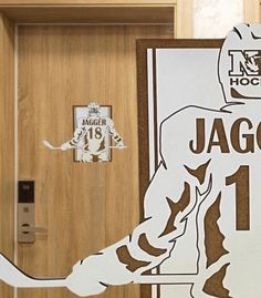 a door with a drawing of a man's leg on it and the name jago 11