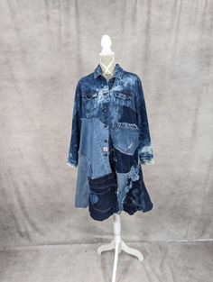 "Upcycled long denim patchwork jacket with frayed seams and jagged hem. Bust measures 36\" when buttoned. Length is approximately 39\". Front denim pockets." Pre-washed Long Sleeve Denim Jacket For Fall, Medium Wash Oversized Outerwear With Patchwork, Oversized Medium Wash Outerwear With Patchwork, Medium Wash Patchwork Denim Jacket, Long Sleeve Recycled Denim Outerwear In Washed Blue, Long Sleeve Washed Blue Recycled Denim Outerwear, Washed Blue Long Sleeve Recycled Denim Outerwear, Oversized Dark Wash Outerwear With Patchwork, Oversized Denim Blue Jacket With Patchwork