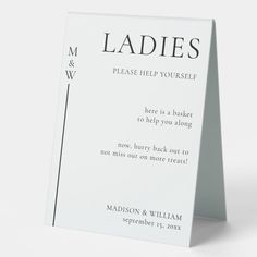 a white card with the words ladies on it