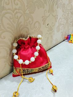 A unique handmade potli bag..using raw silk fabric and embellishments..You can carry it to any occasion..ve it small outing or a wedding Silk Purse, Potli Bag, Raw Silk Fabric, Potli Bags, Wedding Order, Raw Silk, Carbon Emissions, Silk Fabric, Big Day