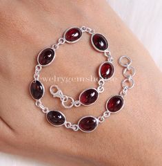 Garnet Bracelet, 925 Sterling Silver Bracelet, January Birthstone Bracelet, Oval Gemstone Bracelet, Handmade Jewelry, Bracelet for Women Gemstone Name - Garnet Stone Quality - AAA  Weight - 7.08 gm Stone Length - 0.8 cm , Stone Width - 0.6 cm   Bracelet Length - 6 inch to 9 inch sizes are available, we give 0.5 inch adjustable in the size which you order ( NOTE - 0.5 INCH ADJUSTABLE IS INCLUDED IN YOUR ORDERED SIZE ) Stone Shape - As shown in the picture We serve complete 925 sterling silver Jewelry and genuine properties of the stone.  The products are dispatched from the small business from UK. Product Quality and Packaging - Our all products are 925 Silver Stamped which shows that the product is genuine and authentic .The products are dispatched from the small business from UK so you ge Sterling Silver Oval Chain Bracelet Gift, Oval Link Gemstone Bracelets As Gift, Silver Gemstone Bracelet With Oval Links, Oval Link Gemstone Bracelet For Gift, Adjustable Sterling Silver Bracelet With Natural Stones, Adjustable Oval Sterling Silver Bracelets, Adjustable Oval Sterling Silver Bracelet, Sterling Silver Oval Bracelet For Gift, Oval Sterling Silver Bracelet As A Gift