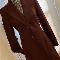 This Long Jacket Is In A Rich Currant Color And A 76% Rayon, 21% Nylon And 3% Spandex Blend. Brown Fitted Long Sleeve Outerwear, Fitted Long Sleeve Fall Outerwear, Fitted Solid Double-breasted Outerwear, Fitted Long Sleeve Blazer For Fall, Fitted Single-breasted Long Sleeve Outerwear, Fitted Single-breasted Outerwear, Classic Stretch Winter Outerwear, Classic Stretch Outerwear For Business Casual, Classic Stretch Outerwear For Formal Occasions