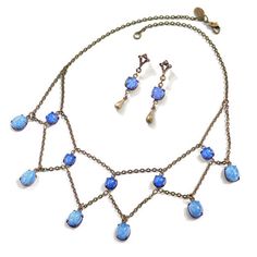 This Delicate But Substantial Vintage Jewelry Set Comes With A Necklace And Pair Of Earrings, On Burnished Bronze Finish. Beautiful Vintage Blue Fire Glass Has A Milky Blue Tone That Works With So Many Things. Perfect Dressed Down With Jeans And Your Favorite Top, Or Dress It Up For A Night Out! Gift Boxed Quality Piece 16-18" Adjustable Length 4ne Blue Teardrop Necklace With Matching Earrings, Blue Dangle Necklaces For Formal Occasions, Elegant Adjustable Blue Jewelry Sets, Star Sapphire Necklace, Taurus Pendant, Ivory Pearl Necklace, Jewelry Wishlist, Cotton Necklace, Red Heart Earrings