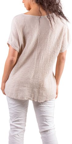 Lightweight and Breathable Waffle Cotton Top. Features a V-Neck with Cap Sleeves. 97% Cotton | 3% Elastic Made in Italy One Size Model 5'7" Relaxed Beige Top For Layering, Textured Tops For Beach, Spring Season, Textured Tops For Beach In Spring, Textured Tops For The Beach In Spring, Textured Tops For Spring Beach Outings, Relaxed Fit Textured Top For Summer, Textured Relaxed Fit Summer Tops, Summer Textured Relaxed Fit Tops, Casual Textured Tops For Layering