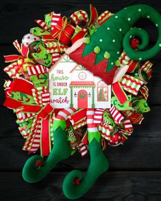 a christmas wreath with stockings and stocking around it