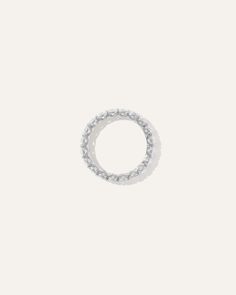 a silver ring on a white background